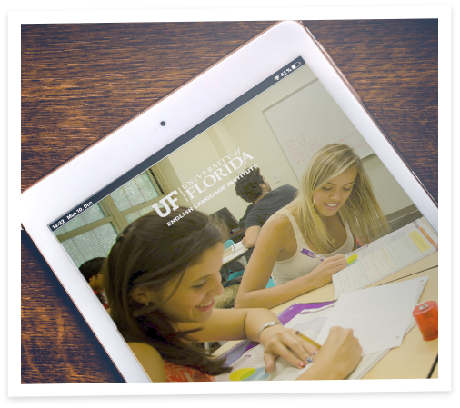 a mobile IXU brochure is displayed on a digital tablet